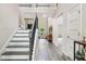 Elegant foyer with a staircase, hardwood floors, and a view into the home's spacious interior at 415 Paynes Lake Rd, Carrollton, GA 30116