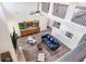 Spacious living area with hardwood floors and a modern blue sofa, ideal for relaxing or entertaining guests at 415 Paynes Lake Rd, Carrollton, GA 30116