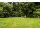 A large, well-maintained lawn with a small outbuilding in the back at 5343 Crystal Ln, Atlanta, GA 30349