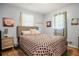 Serene bedroom with hardwood floors, neutral walls, and natural light from the window at 5343 Crystal Ln, Atlanta, GA 30349