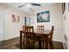 Inviting dining room features a dark wood table and chairs, hardwood floors, and natural lighting at 5343 Crystal Ln, Atlanta, GA 30349