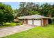 Spacious two-car garage attached to a well-maintained home with a long driveway at 5343 Crystal Ln, Atlanta, GA 30349