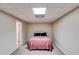 Small basement bedroom showcasing a simple bed and carpet flooring at 1058 Magnolia Dr, Villa Rica, GA 30180