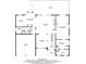 First floor plan featuring a kitchen, breakfast nook, living room, primary bedroom, laundry, dining area, garage, and porch at 1058 Magnolia Dr, Villa Rica, GA 30180