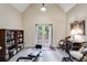 Comfortable sitting room boasts high ceilings, French doors to deck, and built in shelving at 1058 Magnolia Dr, Villa Rica, GA 30180