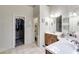 Spacious main bathroom with dual sinks, a walk in closet, and a separate water closet at 1058 Magnolia Dr, Villa Rica, GA 30180