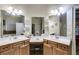 Dual-sink vanity in Primary bathroom with a seated makeup vanity between, and decorative lighting at 1058 Magnolia Dr, Villa Rica, GA 30180
