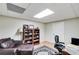 Cozy office space with a leather chair, bookshelf, and home office setup at 1058 Magnolia Dr, Villa Rica, GA 30180