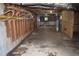 Unfinished basement with exposed rafters, concrete floor, and block walls, offering ample potential for customization at 157 Sequoyah Cir, Canton, GA 30115