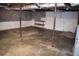 Unfinished basement featuring concrete floor and exposed ceiling elements and cinder block walls offering space for remodeling at 157 Sequoyah Cir, Canton, GA 30115