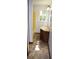 Small bathroom with decorative tile floors, vanity sink, and bright yellow tub at 157 Sequoyah Cir, Canton, GA 30115