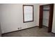 Carpeted bedroom features natural light, a closet, and neutral-colored walls at 157 Sequoyah Cir, Canton, GA 30115