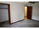 Spacious carpeted bedroom featuring access to closet and another room at 157 Sequoyah Cir, Canton, GA 30115