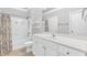 Bright bathroom featuring a shower-tub combo, white vanity, and neutral tile flooring at 1850 Cotillion Dr # 3123, Atlanta, GA 30338