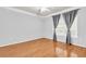 Bedroom with neutral walls, hardwood floors, large windows and ceiling fan at 1850 Cotillion Dr # 3123, Atlanta, GA 30338