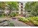 Courtyard features a wooden bridge, a pond, and lush landscaping at 1850 Cotillion Dr # 3123, Atlanta, GA 30338