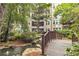 Courtyard features a wooden bridge, a pond, and lush landscaping at 1850 Cotillion Dr # 3123, Atlanta, GA 30338