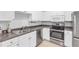 Functional kitchen showcasing stainless steel appliances, white cabinetry, and laminate counters at 1850 Cotillion Dr # 3123, Atlanta, GA 30338