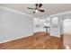 Spacious living room boasts hardwood floors, neutral paint, and an open layout to the kitchen at 1850 Cotillion Dr # 3123, Atlanta, GA 30338