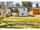 Charming home features a balcony, yellow door, and a spacious backyard with plenty of room to enjoy the outdoors at 236 Barfield Sw Ave, Atlanta, GA 30310