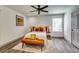 Bright bedroom with ceiling fan, stylish decor, and natural light at 236 Barfield Sw Ave, Atlanta, GA 30310