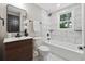 Bright bathroom featuring modern fixtures, marble tiling, and a soaking tub at 4617 Cedar Park Dr, Stone Mountain, GA 30083