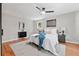 Relaxing bedroom with wood floors, a ceiling fan, and neutral decor at 4617 Cedar Park Dr, Stone Mountain, GA 30083