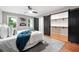 Comfortable bedroom featuring barn door access to a walk-in closet at 4617 Cedar Park Dr, Stone Mountain, GA 30083
