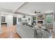 Spacious living room with fireplace, hardwood floors, ceiling fan, and open layout to kitchen at 4617 Cedar Park Dr, Stone Mountain, GA 30083