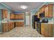 Traditional kitchen with wooden cabinets, modern appliances, and neutral countertops at 112 Lexington Parke Dr, Woodstock, GA 30189