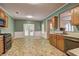 Eat-in kitchen boasting lots of natural light, tiled floor and view to yard at 112 Lexington Parke Dr, Woodstock, GA 30189