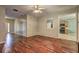 Spacious living room with hardwood floors and an open view into the kitchen at 112 Lexington Parke Dr, Woodstock, GA 30189