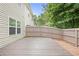 Spacious backyard deck overlooks a lush green landscape with a privacy fence surrounding the property at 257 Ridge Mill Dr, Acworth, GA 30102