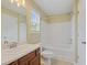 Traditional bathroom with dark vanity, standard toilet and tub/shower combo at 257 Ridge Mill Dr, Acworth, GA 30102