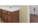 Bathroom vanity with wood cabinets, white countertops, chrome hardware, and a circular basin sink at 257 Ridge Mill Dr, Acworth, GA 30102