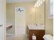 Cozy bathroom features a dark wood vanity, sink, and a standard toilet at 257 Ridge Mill Dr, Acworth, GA 30102
