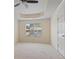 Airy bedroom featuring large window, neutral carpet, and a ceiling fan at 257 Ridge Mill Dr, Acworth, GA 30102
