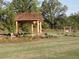 Beautiful community gazebo offers a serene retreat amidst landscaped gardens and mature trees at 257 Ridge Mill Dr, Acworth, GA 30102