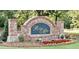 Welcoming entrance sign for Ridge Mill featuring brick pillars, stone accents, and colorful flower beds at 257 Ridge Mill Dr, Acworth, GA 30102
