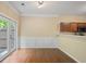 Cozy dining area with French doors to the patio, hardwood floors, and direct access to the kitchen at 257 Ridge Mill Dr, Acworth, GA 30102