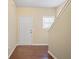 Inviting entryway with hardwood floors, a white door, and a staircase leading to the upper level at 257 Ridge Mill Dr, Acworth, GA 30102