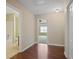 Hallway leading to a bathroom and a bedroom offers hardwood floors and neutral walls at 257 Ridge Mill Dr, Acworth, GA 30102