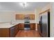 Well-lit kitchen featuring wood cabinets, stainless steel appliances, and light countertops at 257 Ridge Mill Dr, Acworth, GA 30102