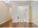 Bright laundry room features open closet with plenty of storage space, with easy access to other rooms and hardwood floors at 257 Ridge Mill Dr, Acworth, GA 30102