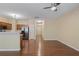 Living space featuring hardwood floors, an open layout into the kitchen and stainless steel refrigerator at 257 Ridge Mill Dr, Acworth, GA 30102