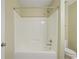 Brightly lit shower with white shower surround features chrome fixtures and rainfall shower head at 257 Ridge Mill Dr, Acworth, GA 30102