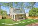 Spacious backyard with lush green lawn, patio, and stylish exterior of the two-story home at 504 Barrington Drive, Roswell, GA 30075