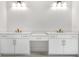 Bright bathroom featuring dual vanities, white cabinets, and modern fixtures at 504 Barrington Drive, Roswell, GA 30075
