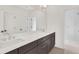 Bright bathroom featuring dual vanity and a glass enclosed shower at 504 Barrington Drive, Roswell, GA 30075