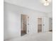 Bright bedroom with neutral walls, carpet, closet, and a recessed light fixture at 504 Barrington Drive, Roswell, GA 30075